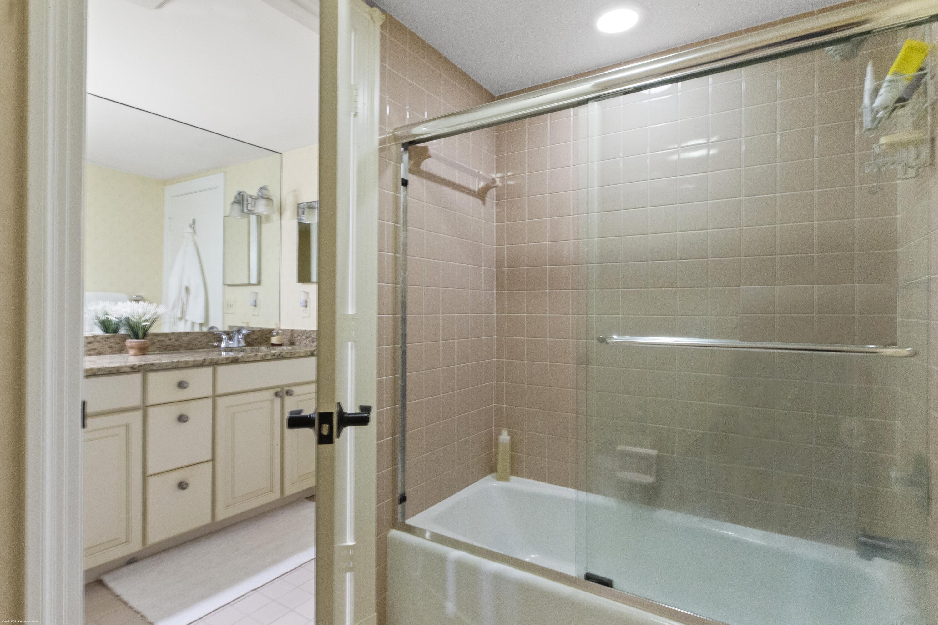 13244 Polo Club Road, Unit C206 Wellington, FL 33414 - Photo 17 of 46 a bathroom with a shower and a sink