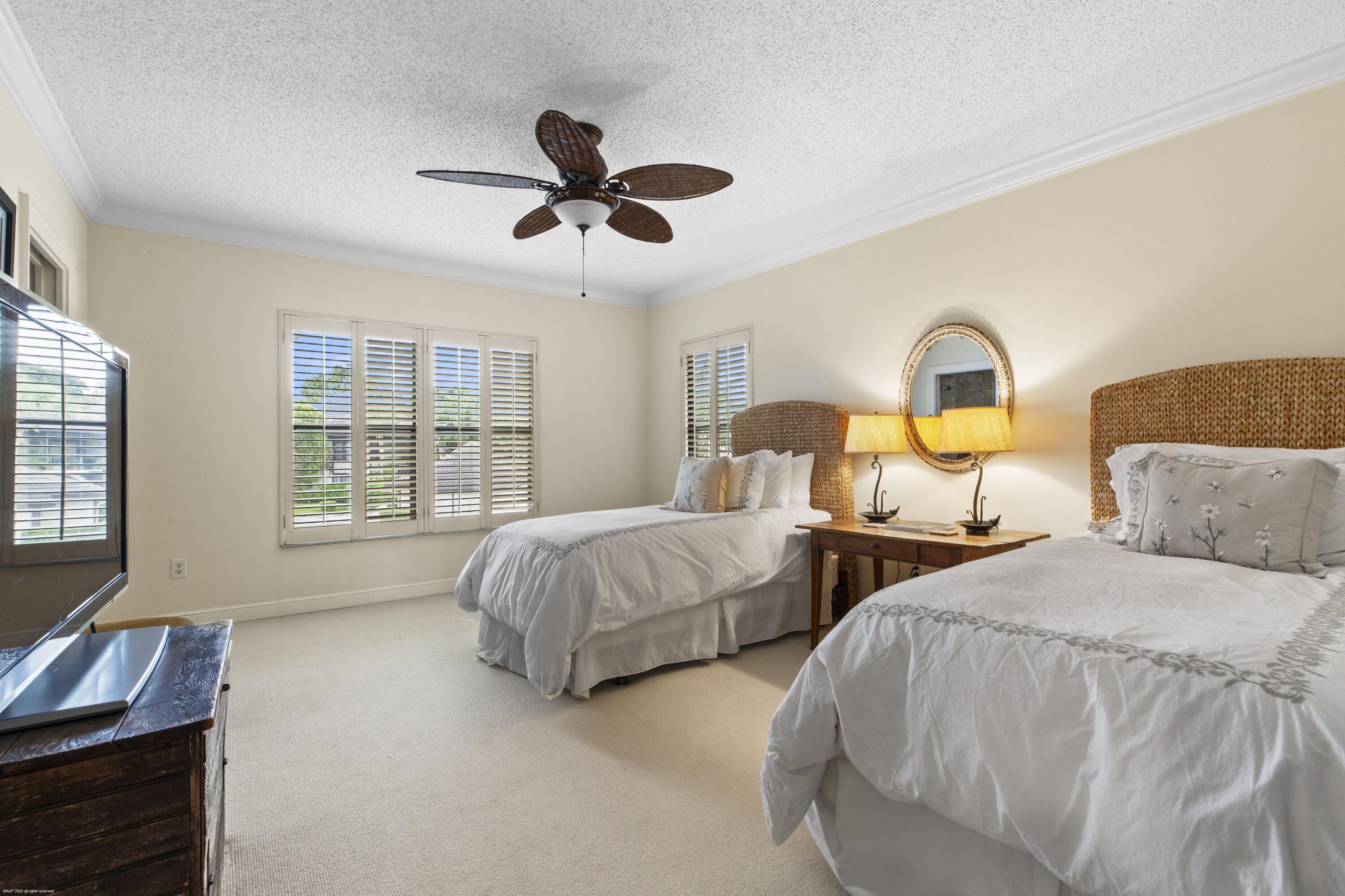 13244 Polo Club Road, Unit C206 Wellington, FL 33414 - Photo 18 of 46 a bedroom with two beds and windows