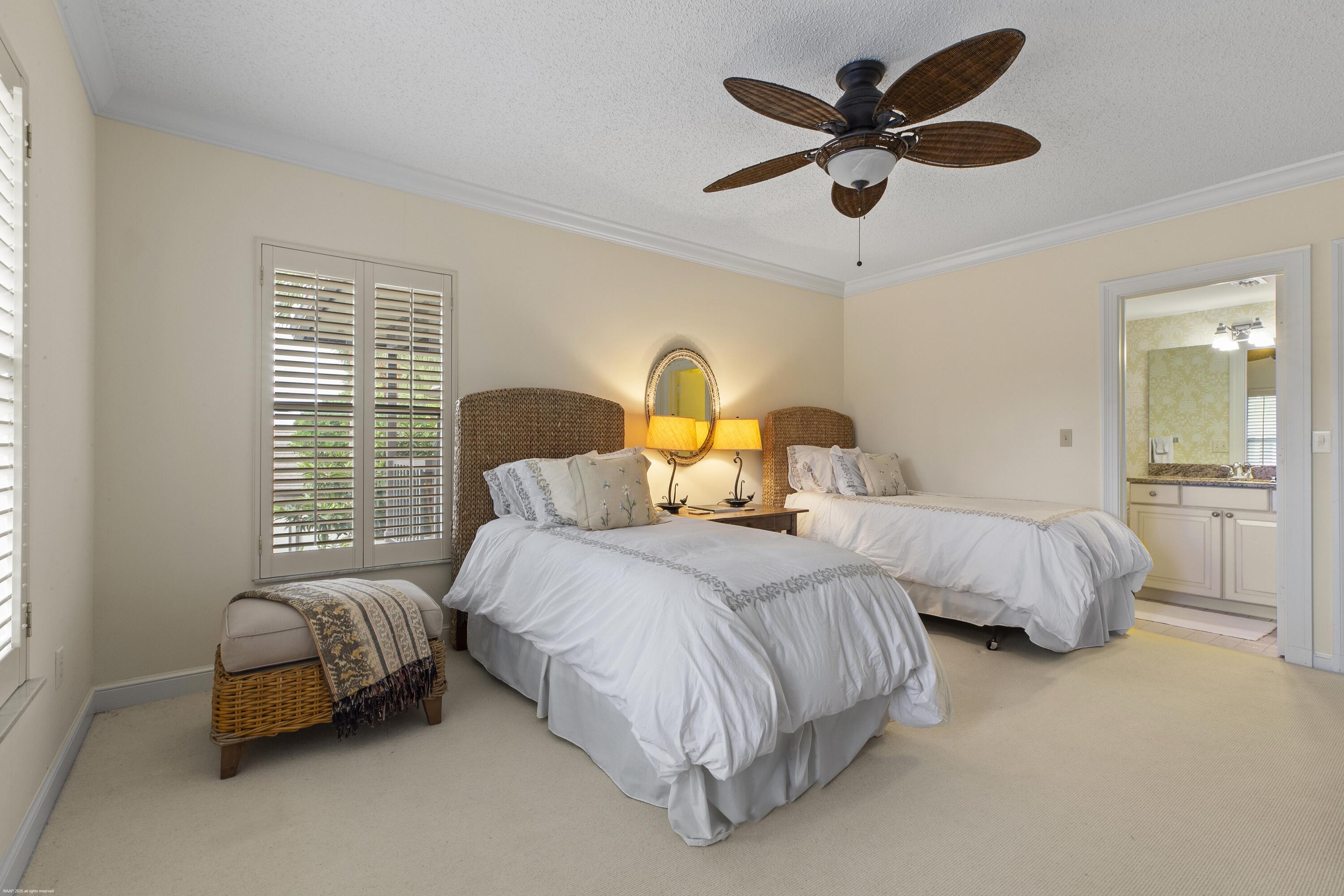 13244 Polo Club Road, Unit C206 Wellington, FL 33414 - Photo 19 of 46 a bedroom with two beds and painting on the wall