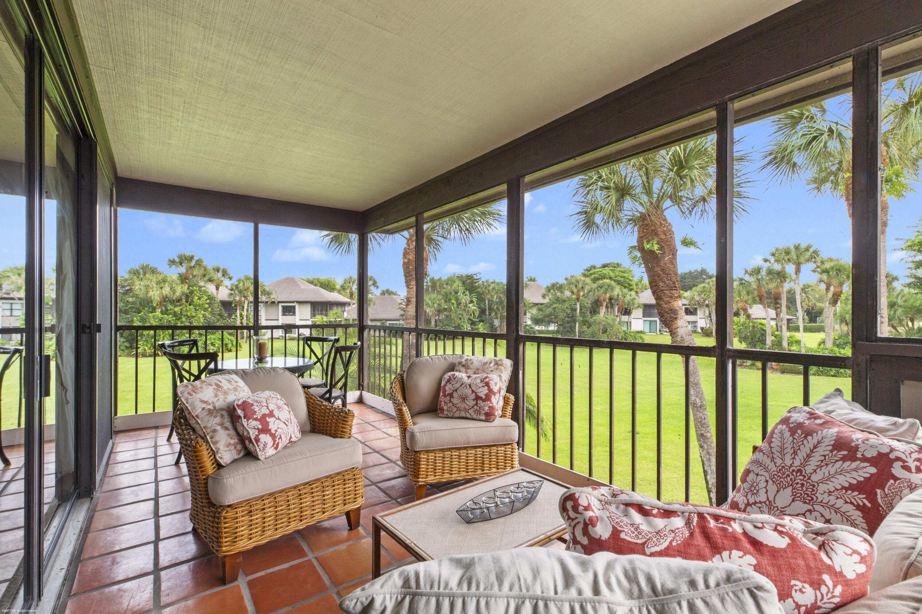 13244 Polo Club Road, Unit C206 Wellington, FL 33414 - Photo 21 of 46 a bedroom with furniture and a large window