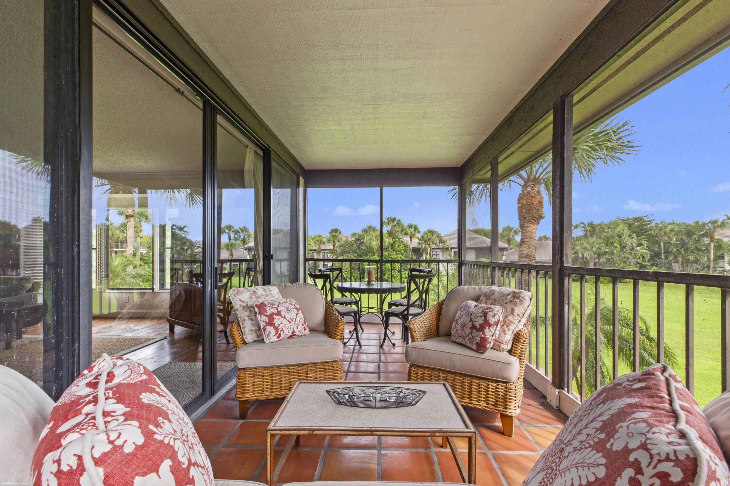 13244 Polo Club Road, Unit C206 Wellington, FL 33414 - Photo 22 of 46 a living room with large windows