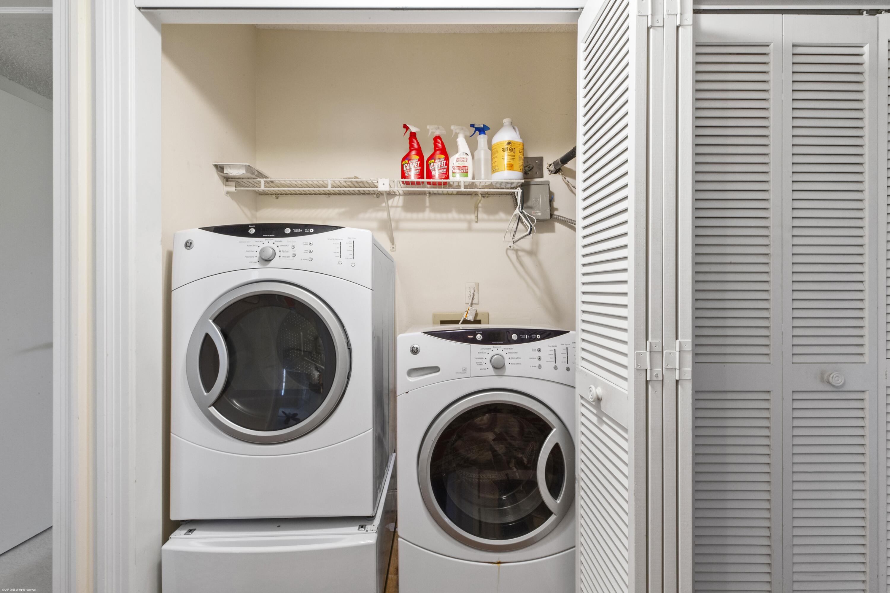 13244 Polo Club Road, Unit C206 Wellington, FL 33414 - Photo 23 of 46 a utility room with dryer and washer
