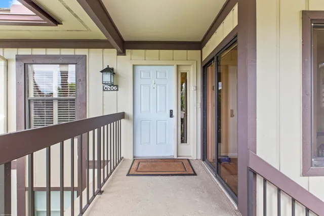 a view of a porch with wooden floor and stairs