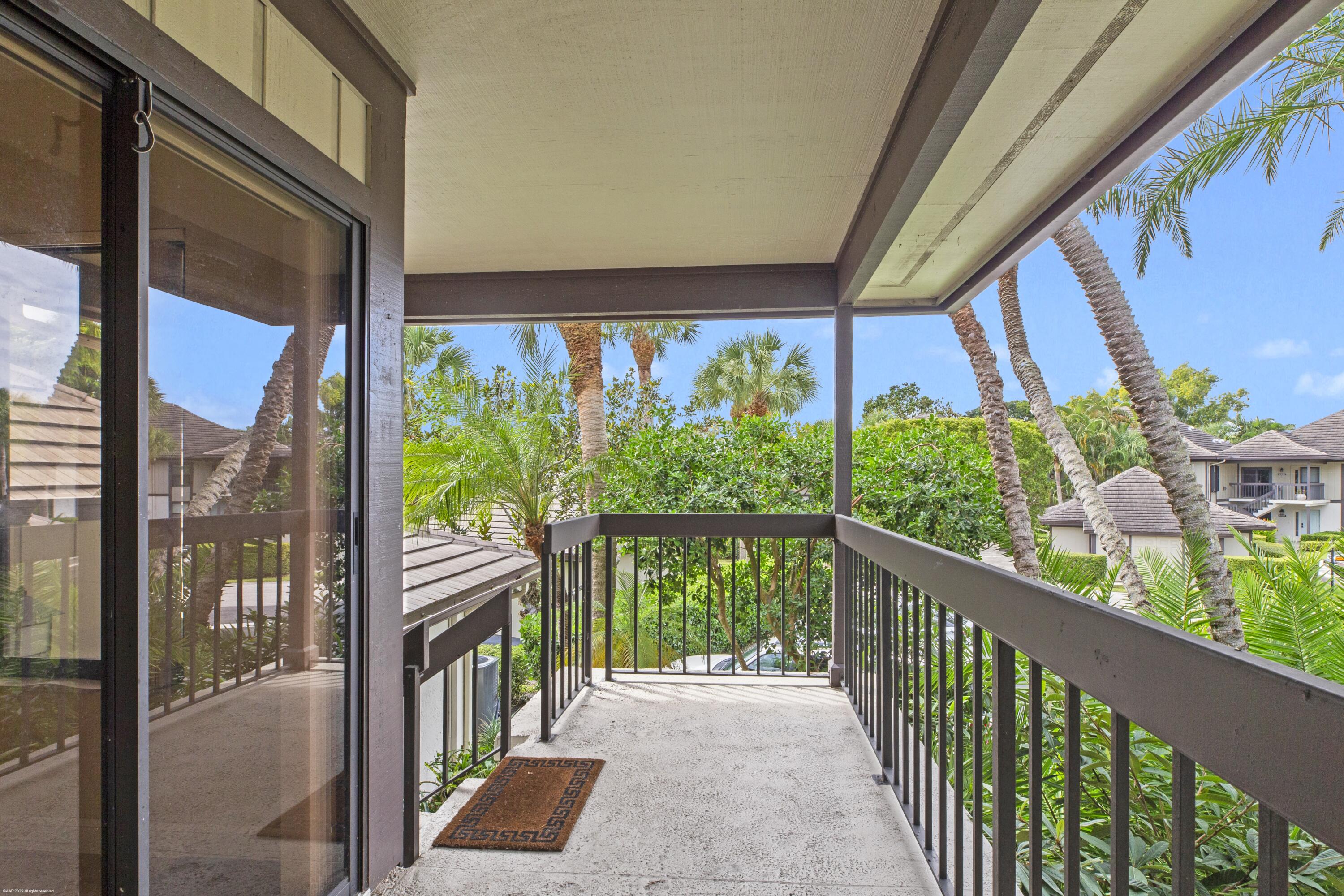 13244 Polo Club Road, Unit C206 Wellington, FL 33414 - Photo 32 of 46 a view of a city from a balcony