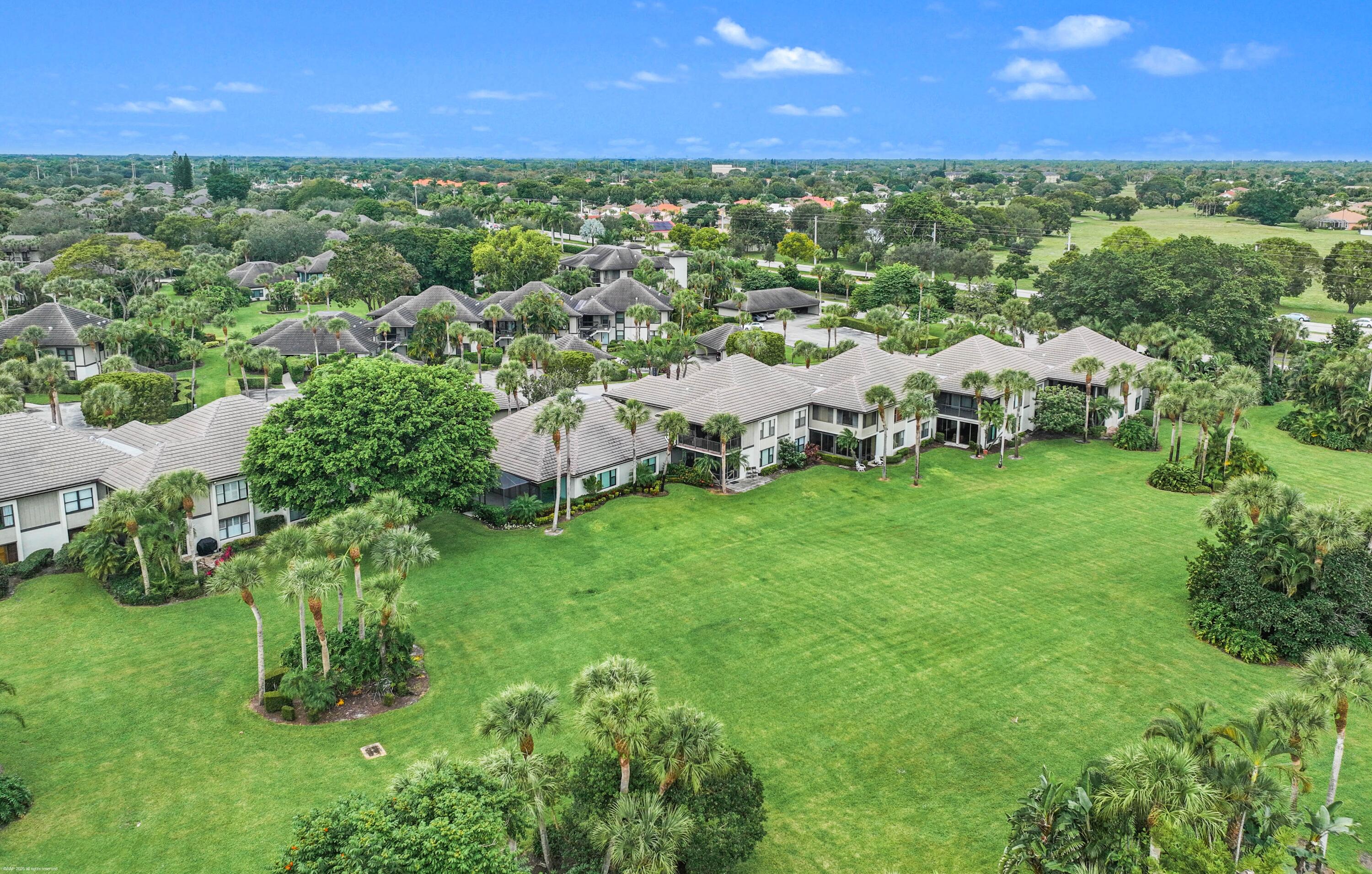 13244 Polo Club Road, Unit C206 Wellington, FL 33414 - Photo 35 of 46 a view of a yard with plants