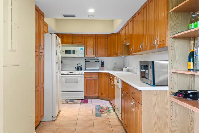 a kitchen with stainless steel appliances granite countertop a sink and cabinets