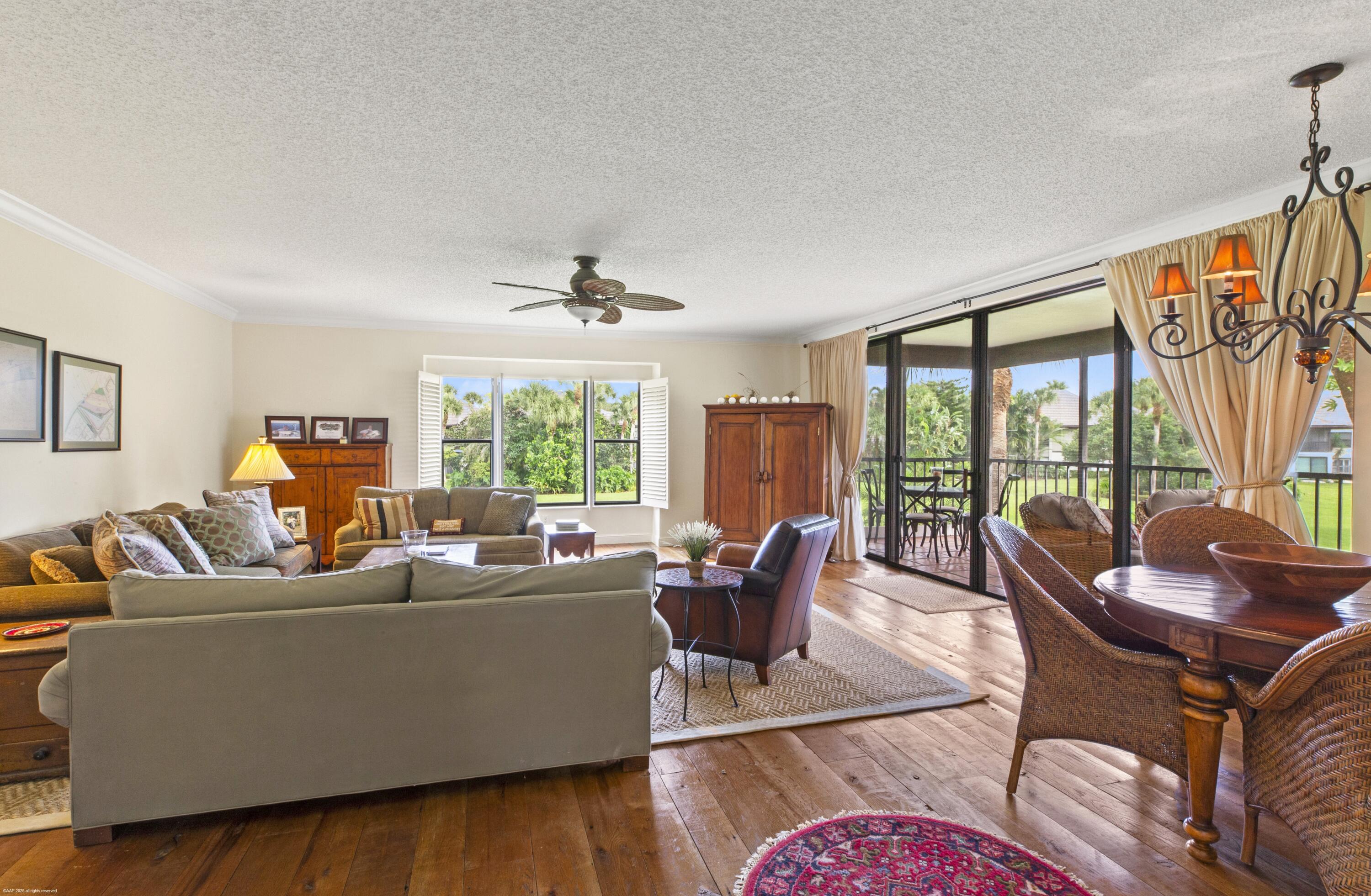 13244 Polo Club Road, Unit C206 Wellington, FL 33414 - Photo 10 of 46 a living room with furniture and a large window