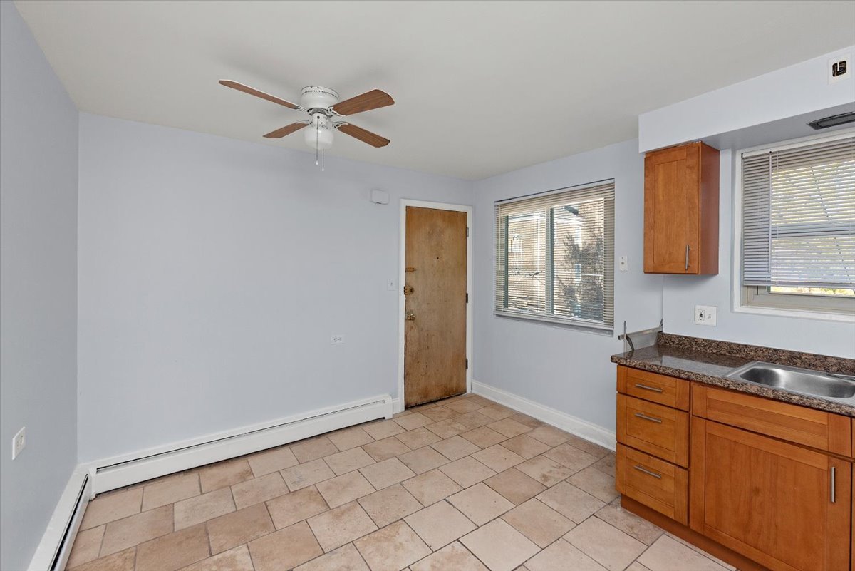 335 Custer Avenue, Unit 2S Evanston, IL 60202 - Photo 8 of 10 a bedroom with a bed and a window