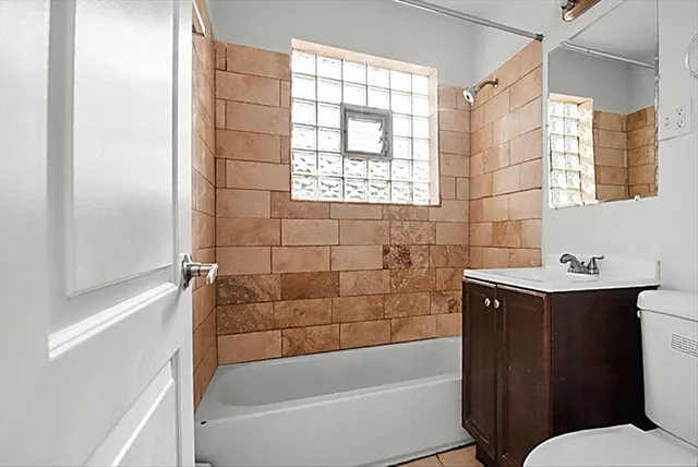 a bathroom with a bathtub sink and toilet