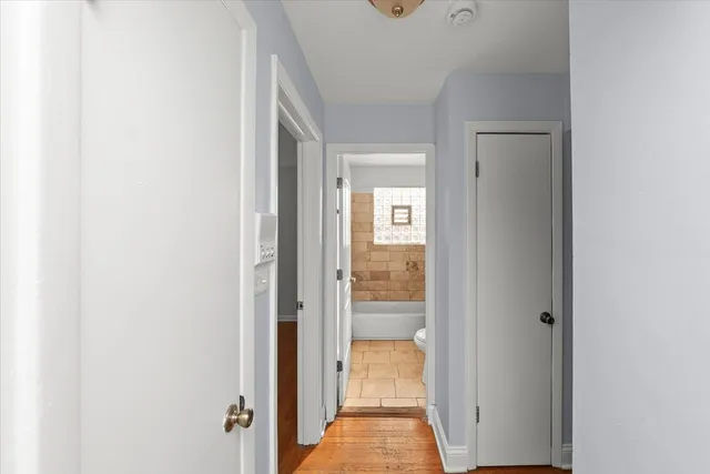 a view of a bathroom from a hallway