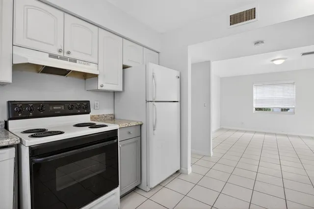 a bathroom with a sink mirror toilet and bathtub