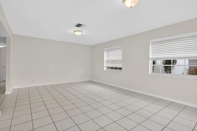 a view of an empty room and window