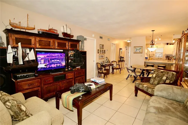 a bedroom with a bed and a television