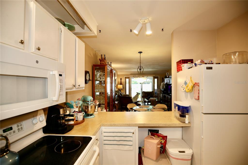 679 Melanie Lane Altamonte Springs, FL 32701 - Photo 5 of 23 a kitchen with a sink appliances and cabinets