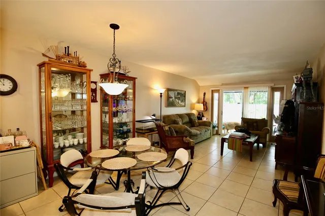 a view of a living room with furniture and a flat screen tv