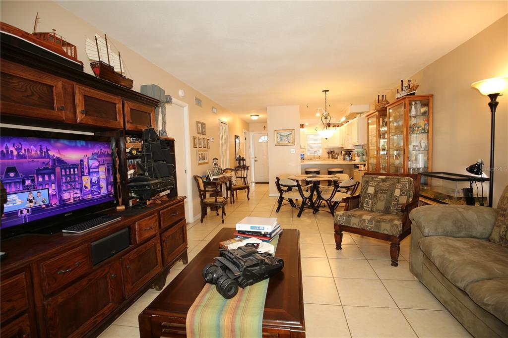 679 Melanie Lane Altamonte Springs, FL 32701 - Photo 9 of 23 a view of a living room with furniture and a flat screen tv