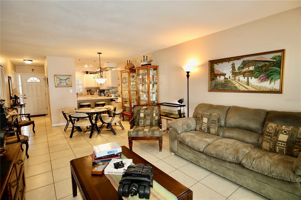 679 Melanie Lane Altamonte Springs, FL 32701 - Photo 10 of 23 a living room with furniture and a flat screen tv