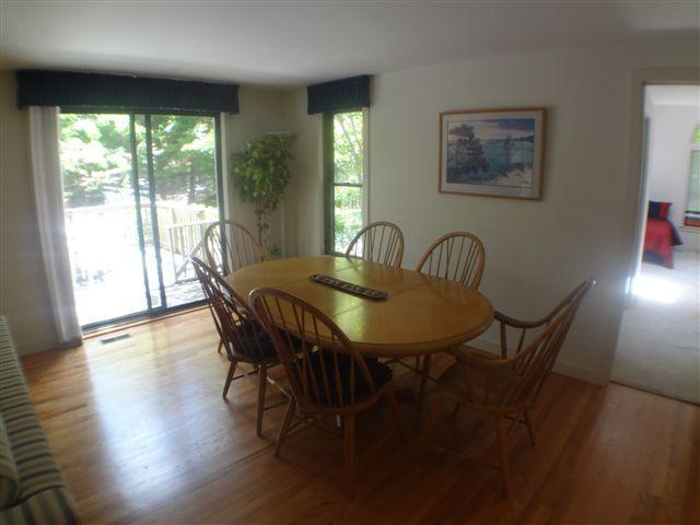 111 Fells Pond Road Mashpee, MA 02649 - Photo 3 of 15 a view of a dining room with furniture and wooden floor