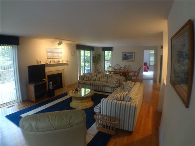 111 Fells Pond Road Mashpee, MA 02649 - Photo 4 of 15 a living room with furniture and a flat screen tv