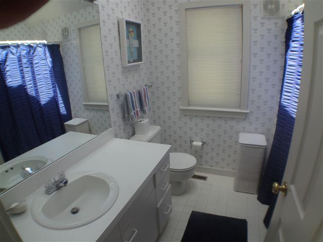 111 Fells Pond Road Mashpee, MA 02649 - Photo 6 of 15 a bathroom with a sink and a mirror