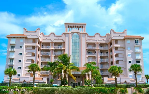 a front view of a building with garden