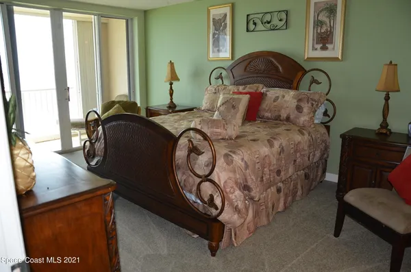 a bedroom with bed and a window