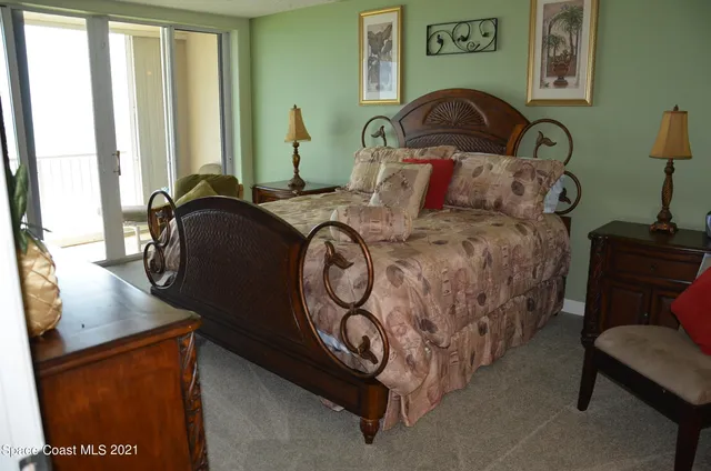 a bedroom with bed and a window