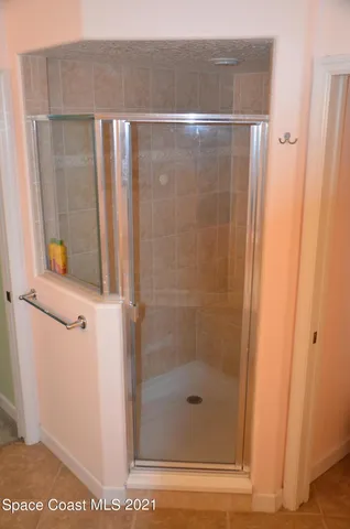 a bathroom with a glass shower door