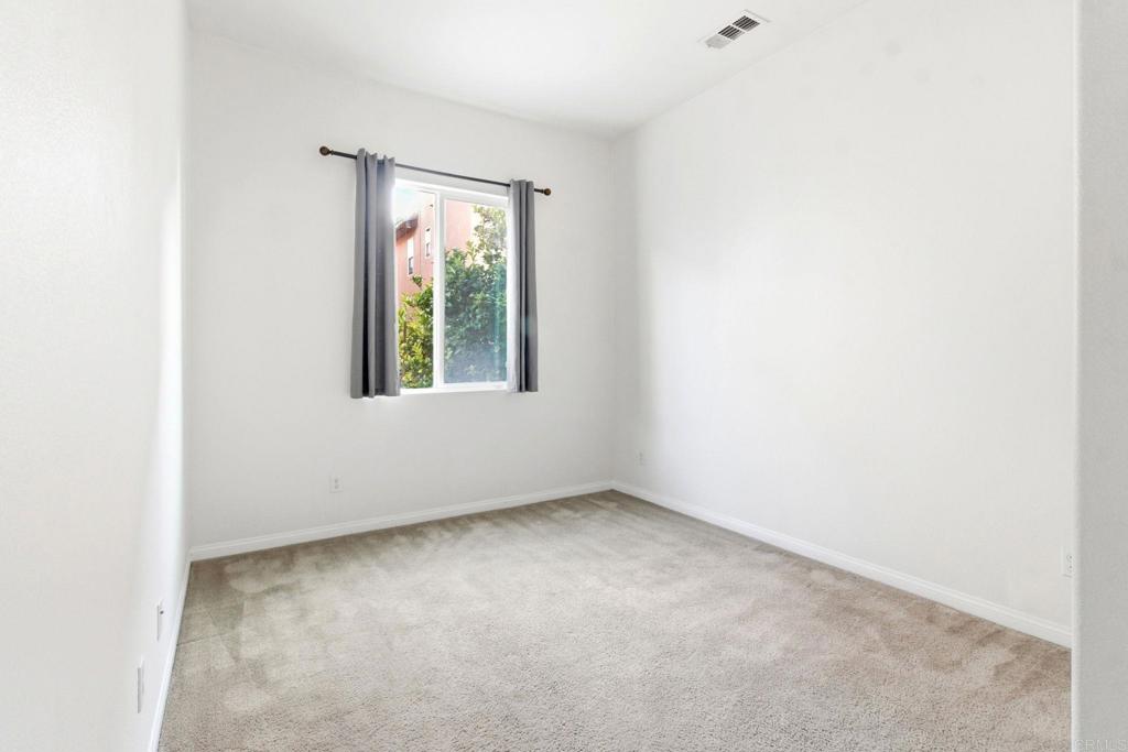 1508 Carpinteria Street Chula Vista, CA 91913 - Photo 25 of 39 an empty room with a window