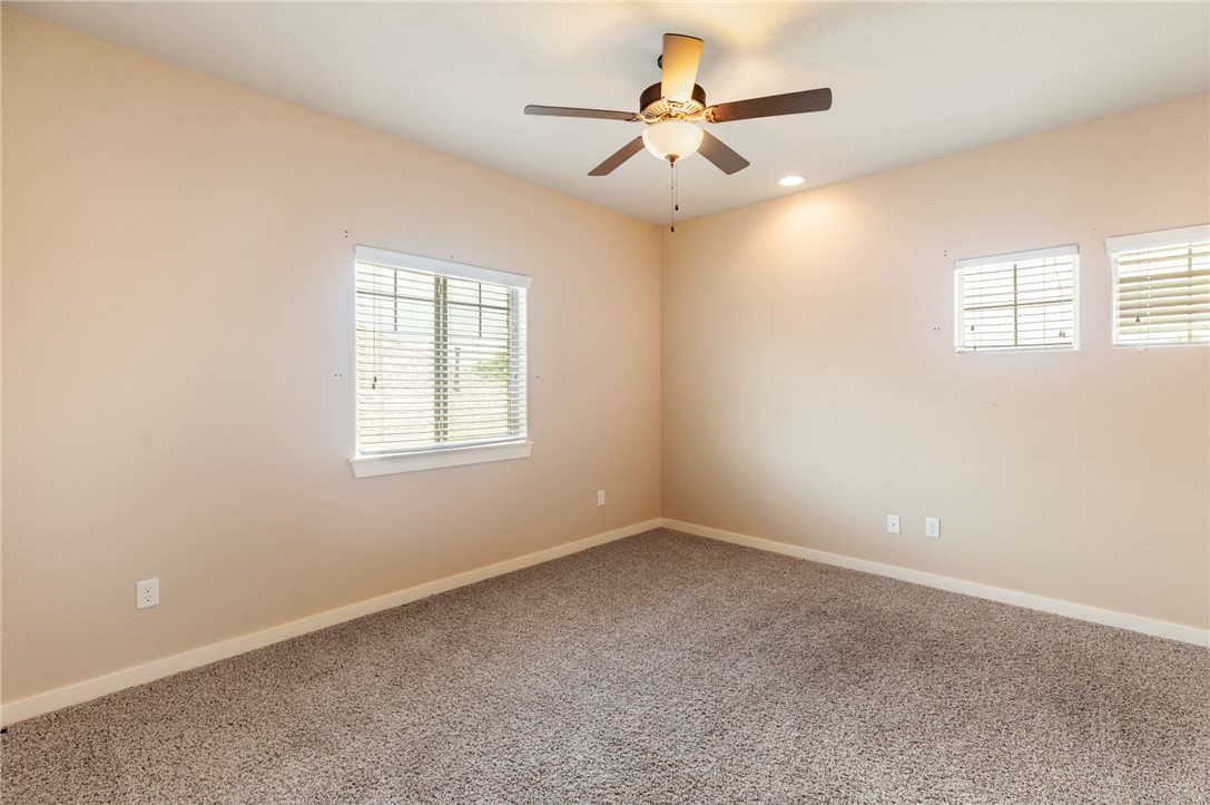 2136 Rockcliffe Loop College Station, TX 77845 - Photo 38 of 48 an empty room with a window and a fan