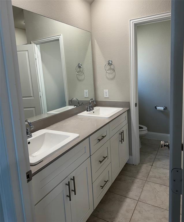 1659 Timpson Drive Forney, TX 75126 - Photo 7 of 10 a bathroom with a sink and a mirror