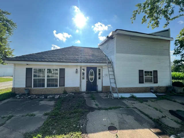 a front view of a house with yard