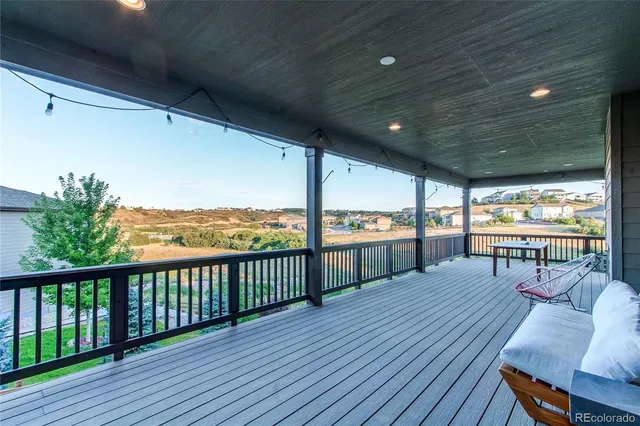 a view of a roof deck with couches