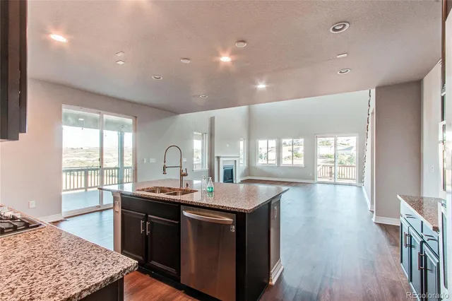 a view of an empty room and fire place