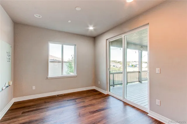 a view of front door with wooden floor