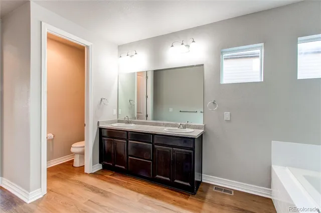 a view of room with wooden floor