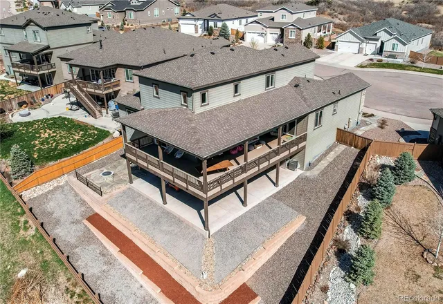 an aerial view of a house with roof deck