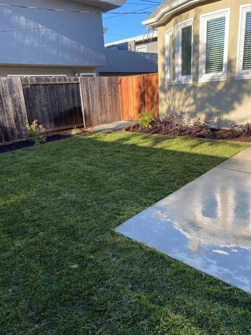 a view of a backyard with an outdoor space