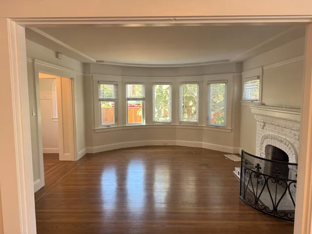 a view of livingroom with furniture fireplace and window