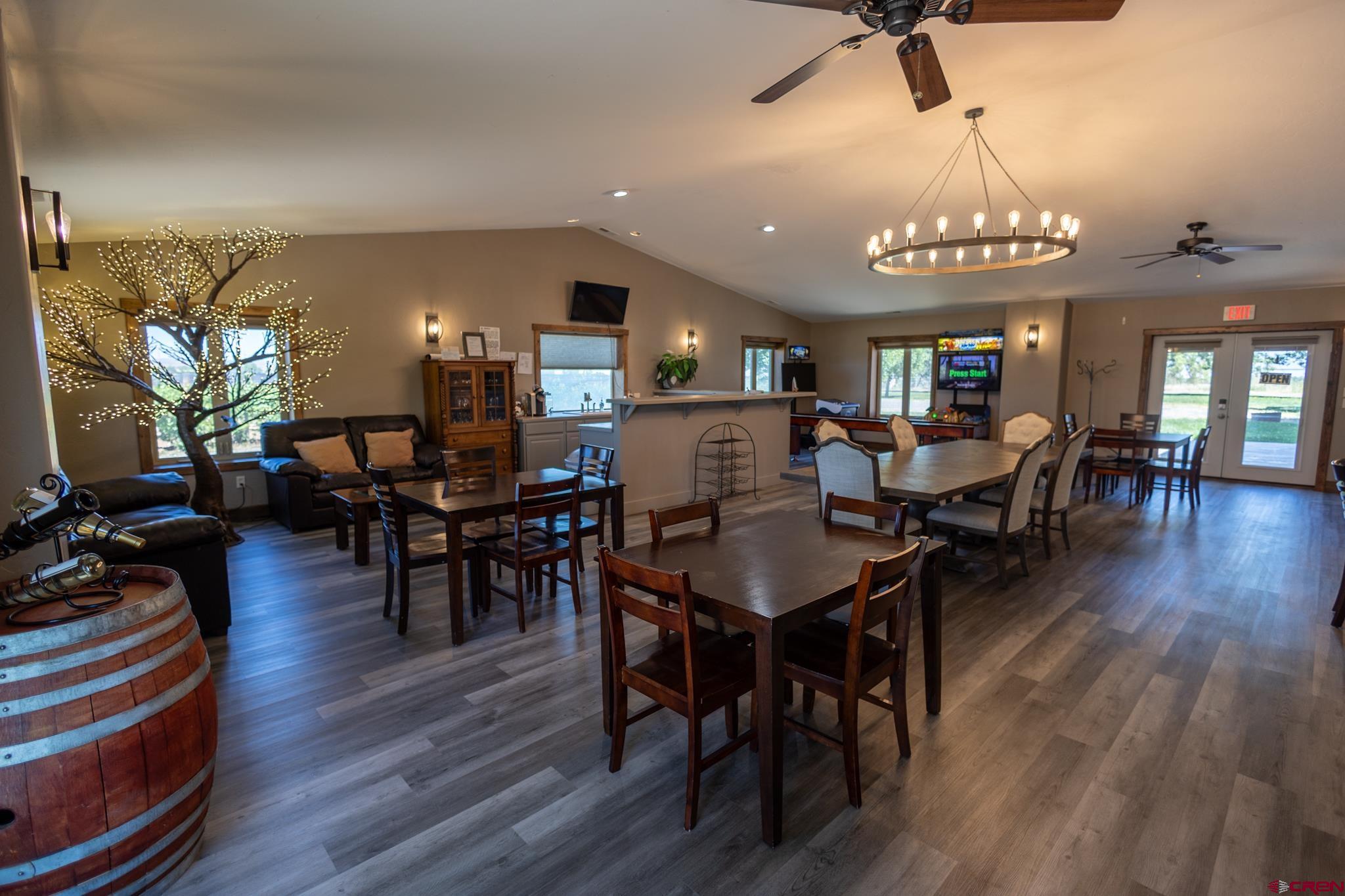 53582 Falcon Road Olathe, CO 81425 - Photo 22 of 35 a view of a dining room with furniture window and wooden floor