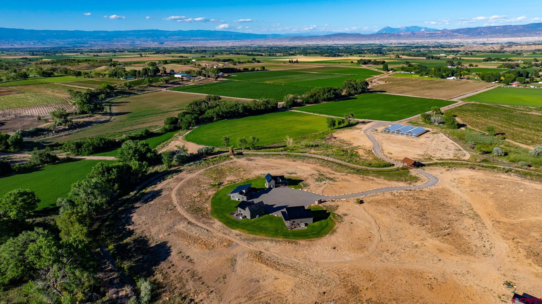 53582 Falcon Road Olathe, CO 81425 - Photo 35 of 35 an aerial view of a houses with a yard and lake view