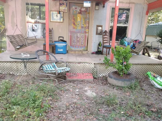 a view of a room with table and chairs