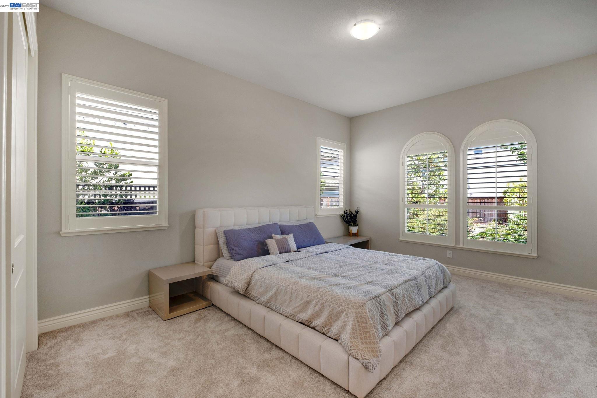 128 Dunfirth Drive Hayward, CA 94542 - Photo 26 of 60 a bedroom with a bed and a window