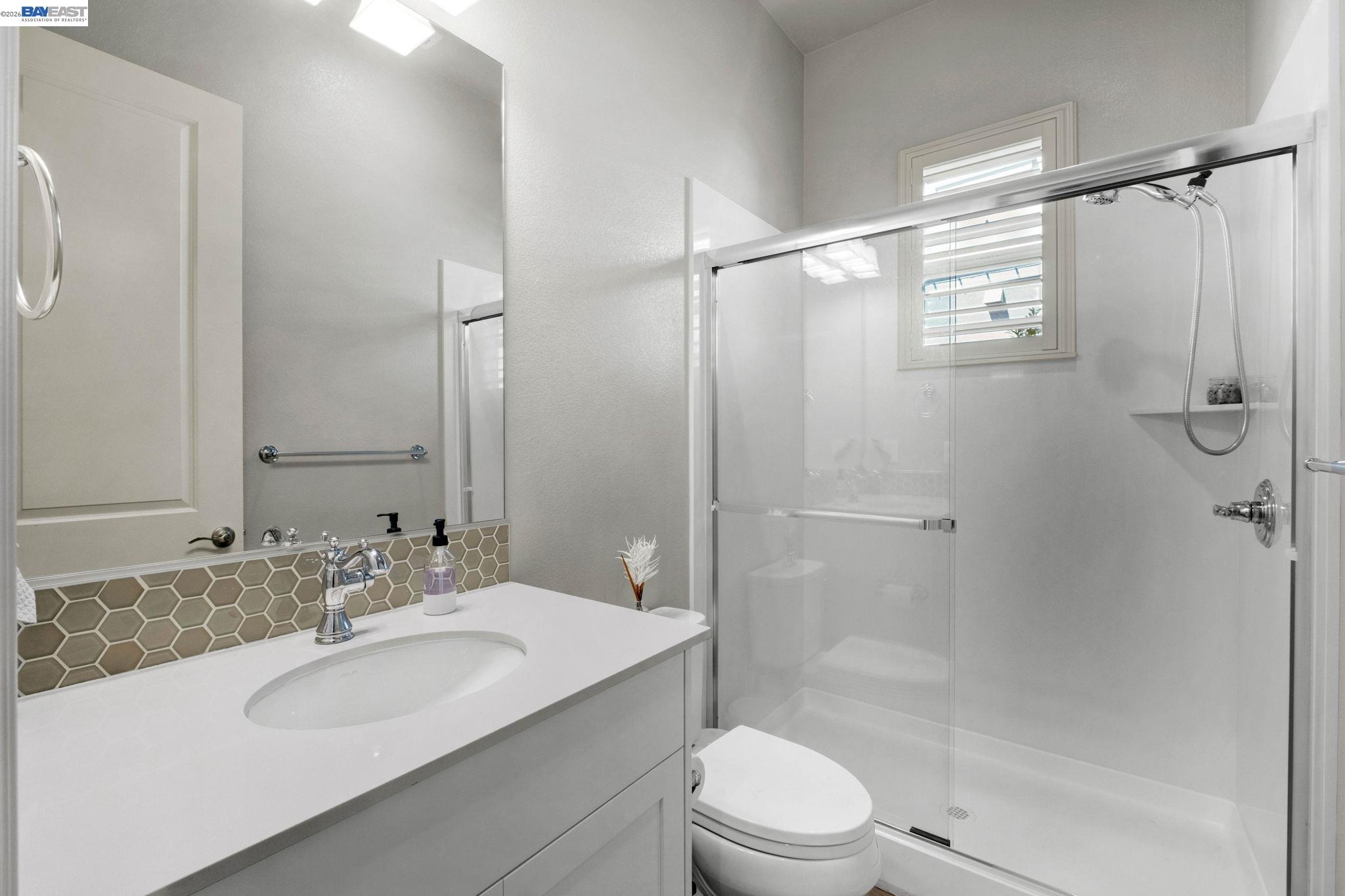 128 Dunfirth Drive Hayward, CA 94542 - Photo 27 of 60 a bathroom with a sink toilet and shower