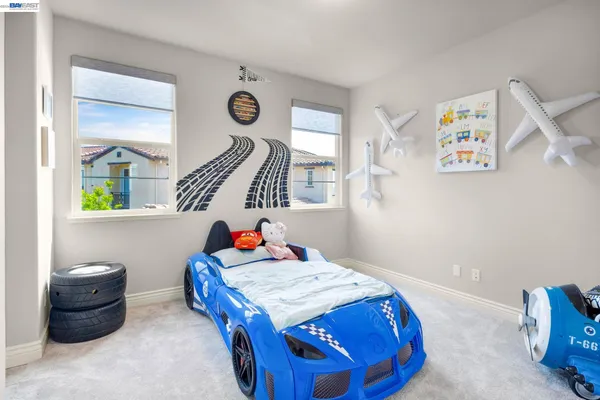 a view of a hallway with closet and a rug
