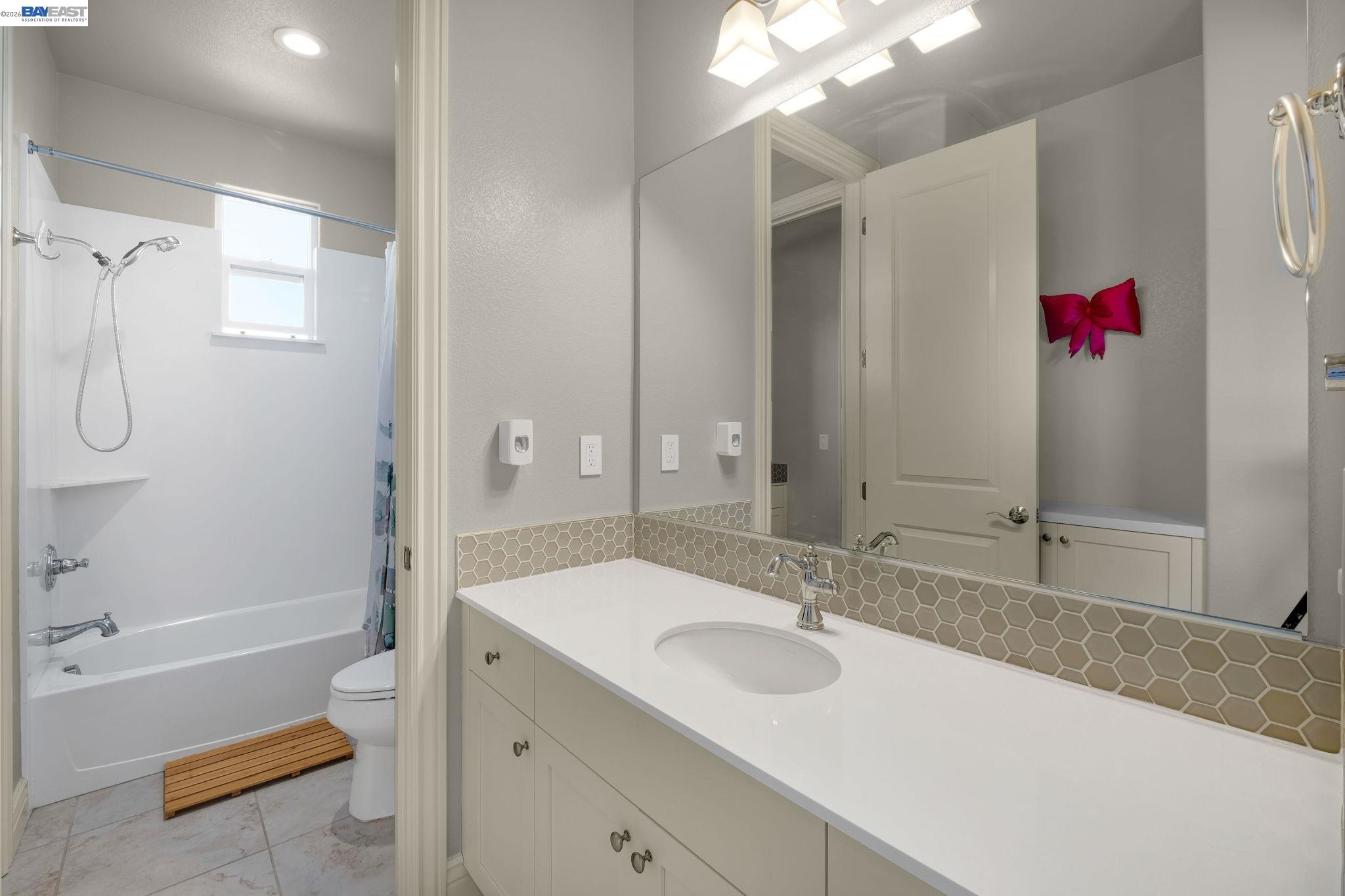 128 Dunfirth Drive Hayward, CA 94542 - Photo 31 of 60 a bathroom with a granite countertop sink and a mirror