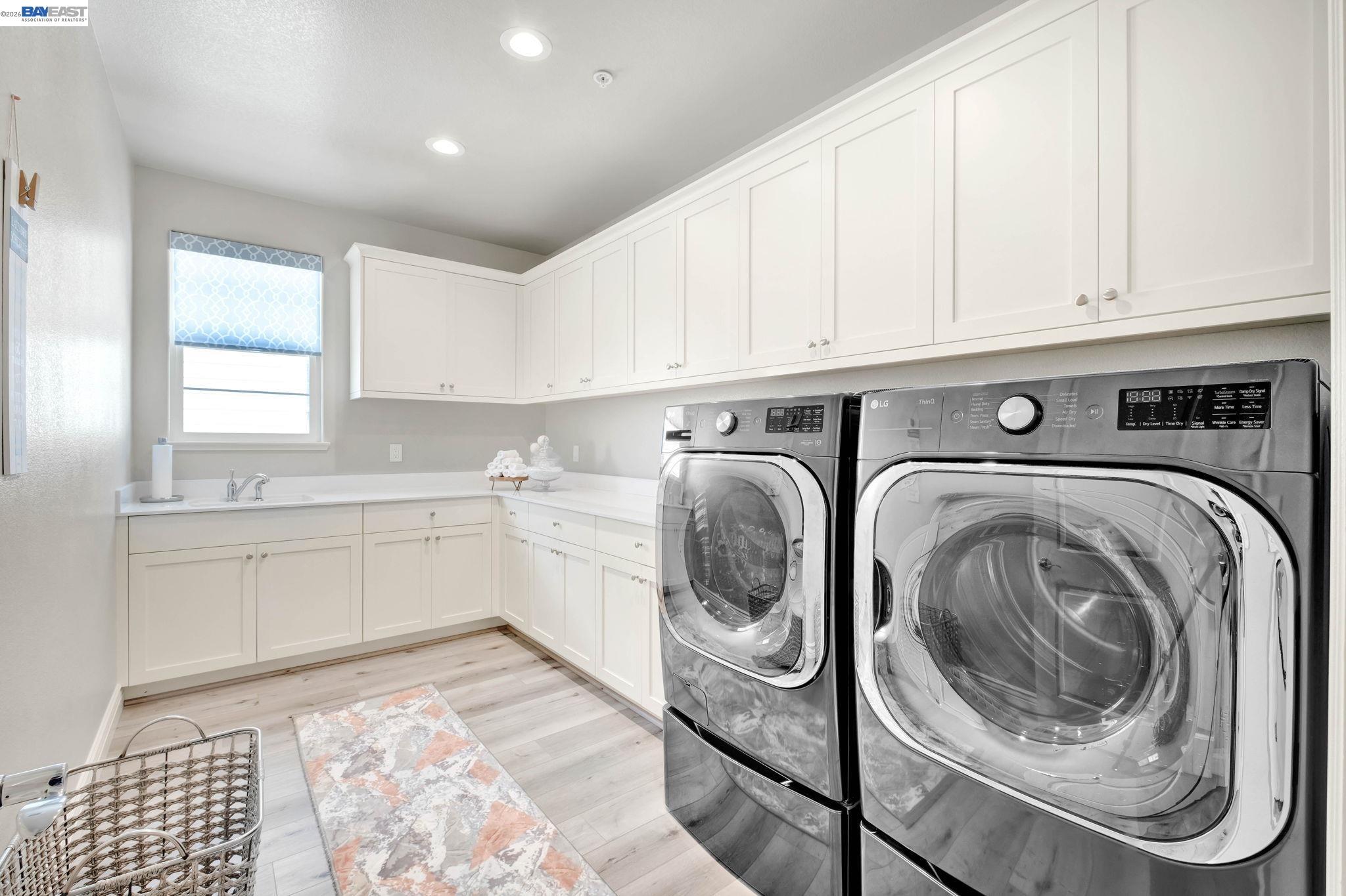 128 Dunfirth Drive Hayward, CA 94542 - Photo 32 of 60 a utility room with sink dryer and washer