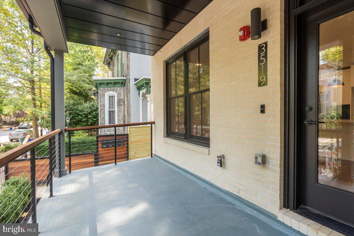 3519 Hamilton Street, Unit B Philadelphia, PA 19104 - Photo 3 of 16 a view of a porch with wooden floor and stairs