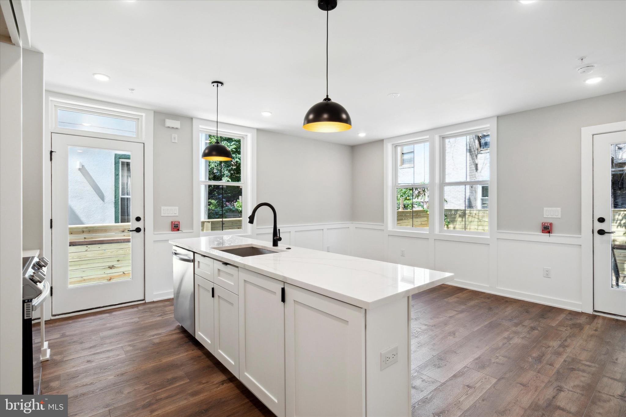 3519 Hamilton Street, Unit B Philadelphia, PA 19104 - Photo 7 of 16 a kitchen with a sink stove and cabinets