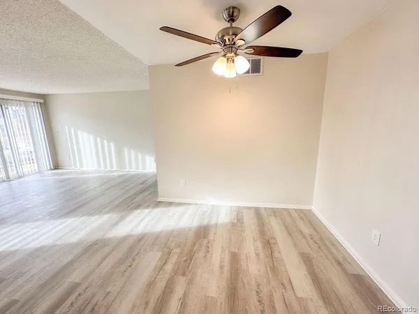wooden floor in a hall with a window